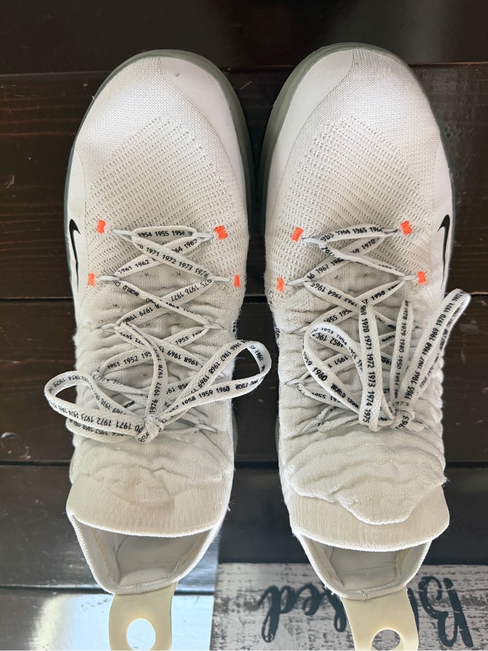 Nike Men’s White Knit Sneakers with Orange Lace Accents